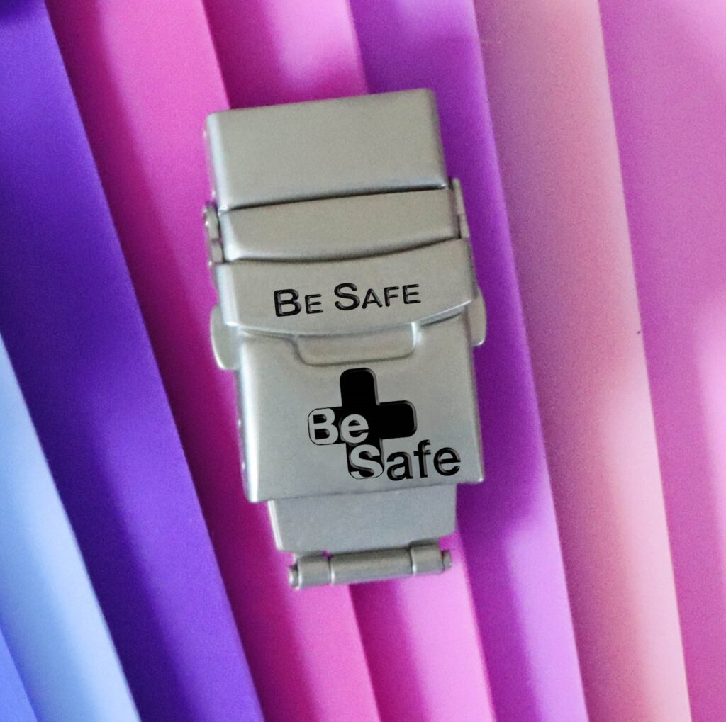 be safe clasp and faceplate on colored background